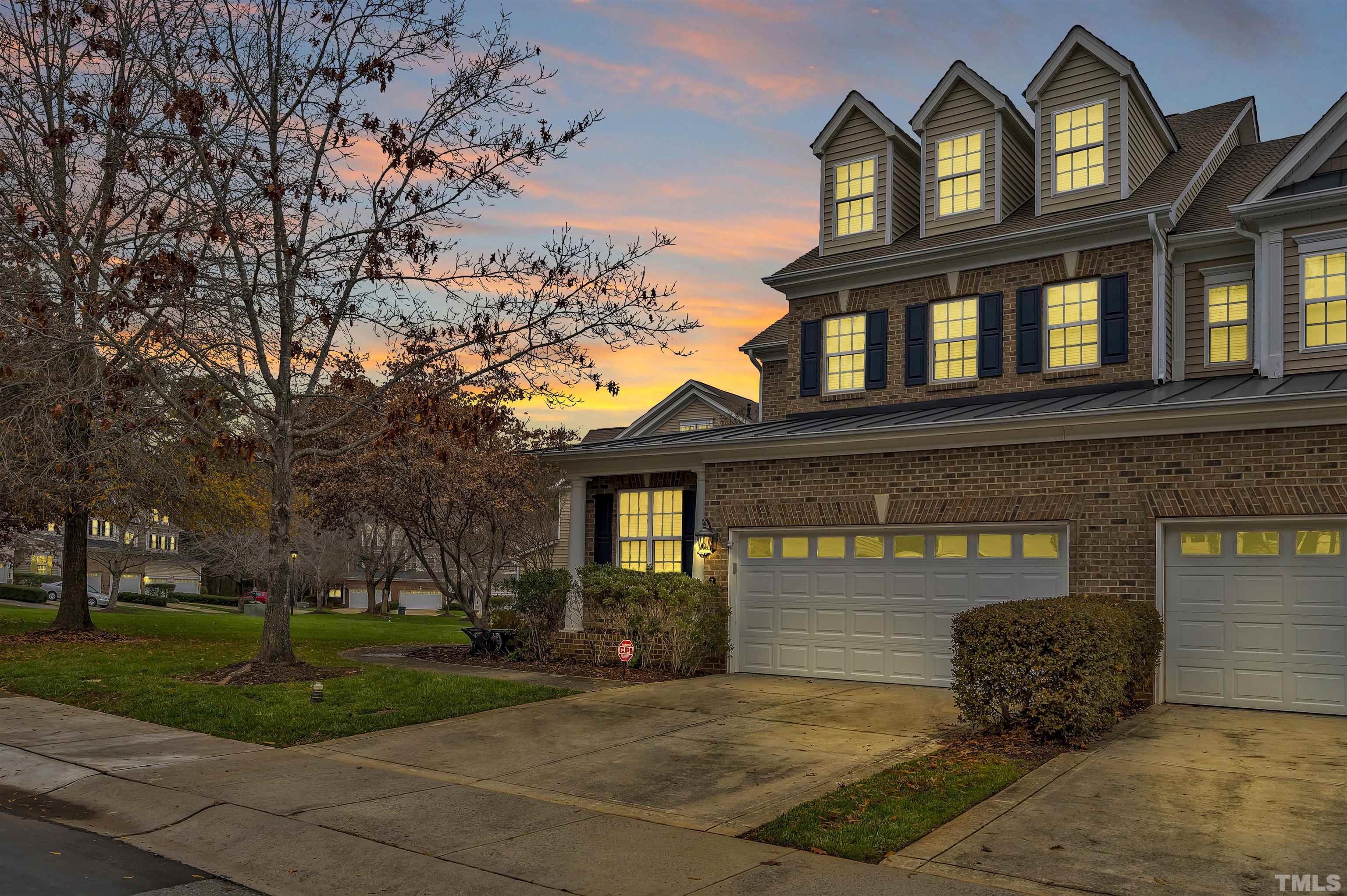 203 Towne Ridge Lane Chapel Hill, NC 27516 - Photo 1 of 38 a front view of a house with garden