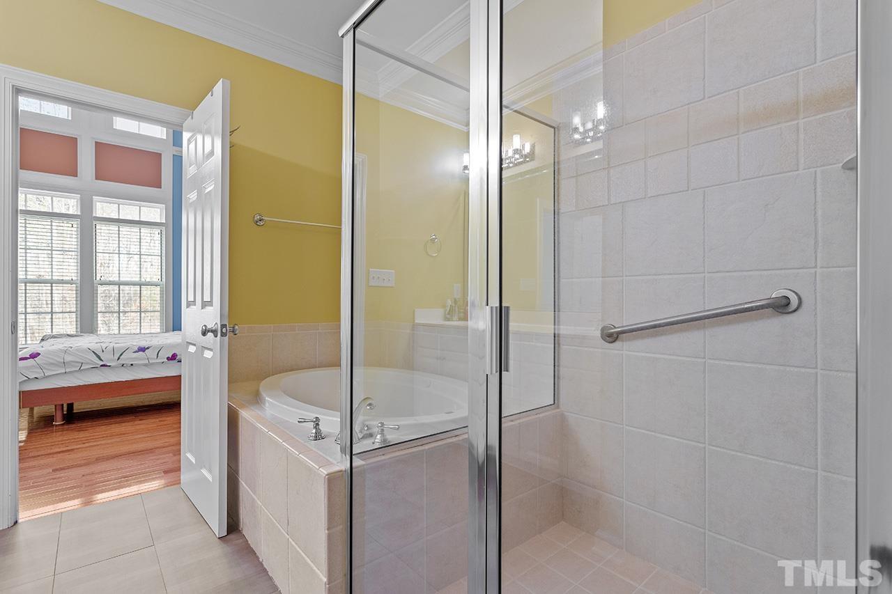 203 Towne Ridge Lane Chapel Hill, NC 27516 - Photo 19 of 38 a bathroom with a tub shower and sink