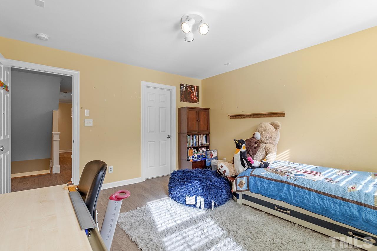 203 Towne Ridge Lane Chapel Hill, NC 27516 - Photo 23 of 38 a bedroom with bed and a window