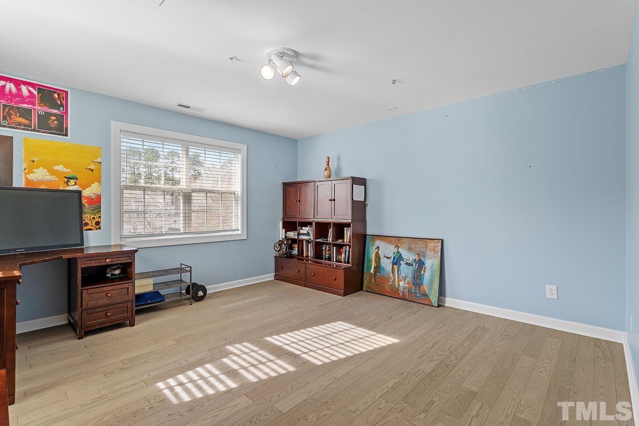 203 Towne Ridge Lane Chapel Hill, NC 27516 - Photo 24 of 38 a bedroom with furniture and window