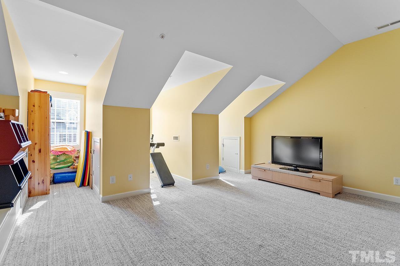 203 Towne Ridge Lane Chapel Hill, NC 27516 - Photo 28 of 38 a view of an empty room with a fireplace