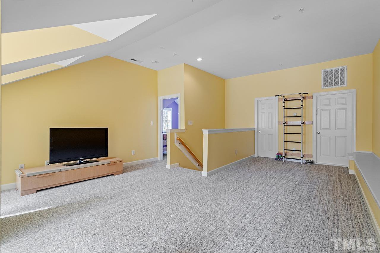 203 Towne Ridge Lane Chapel Hill, NC 27516 - Photo 29 of 38 a view of an empty room with furniture and wooden floor
