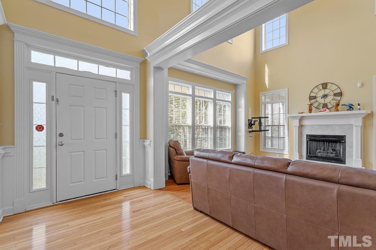 203 Towne Ridge Lane Chapel Hill, NC 27516 - Photo 3 of 38 a living room with furniture and a fireplace