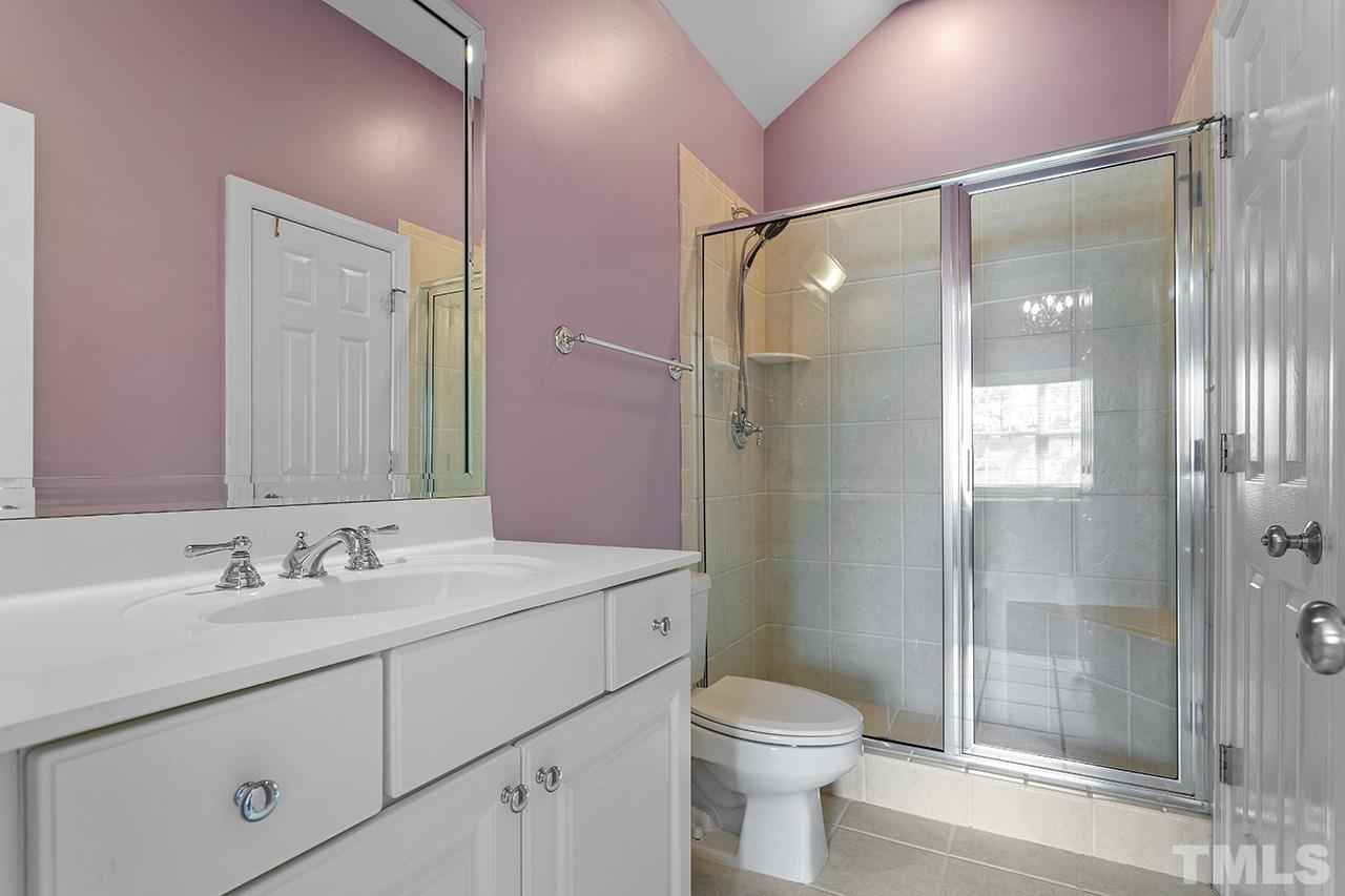 203 Towne Ridge Lane Chapel Hill, NC 27516 - Photo 32 of 38 a bathroom with a sink shower and a toilet