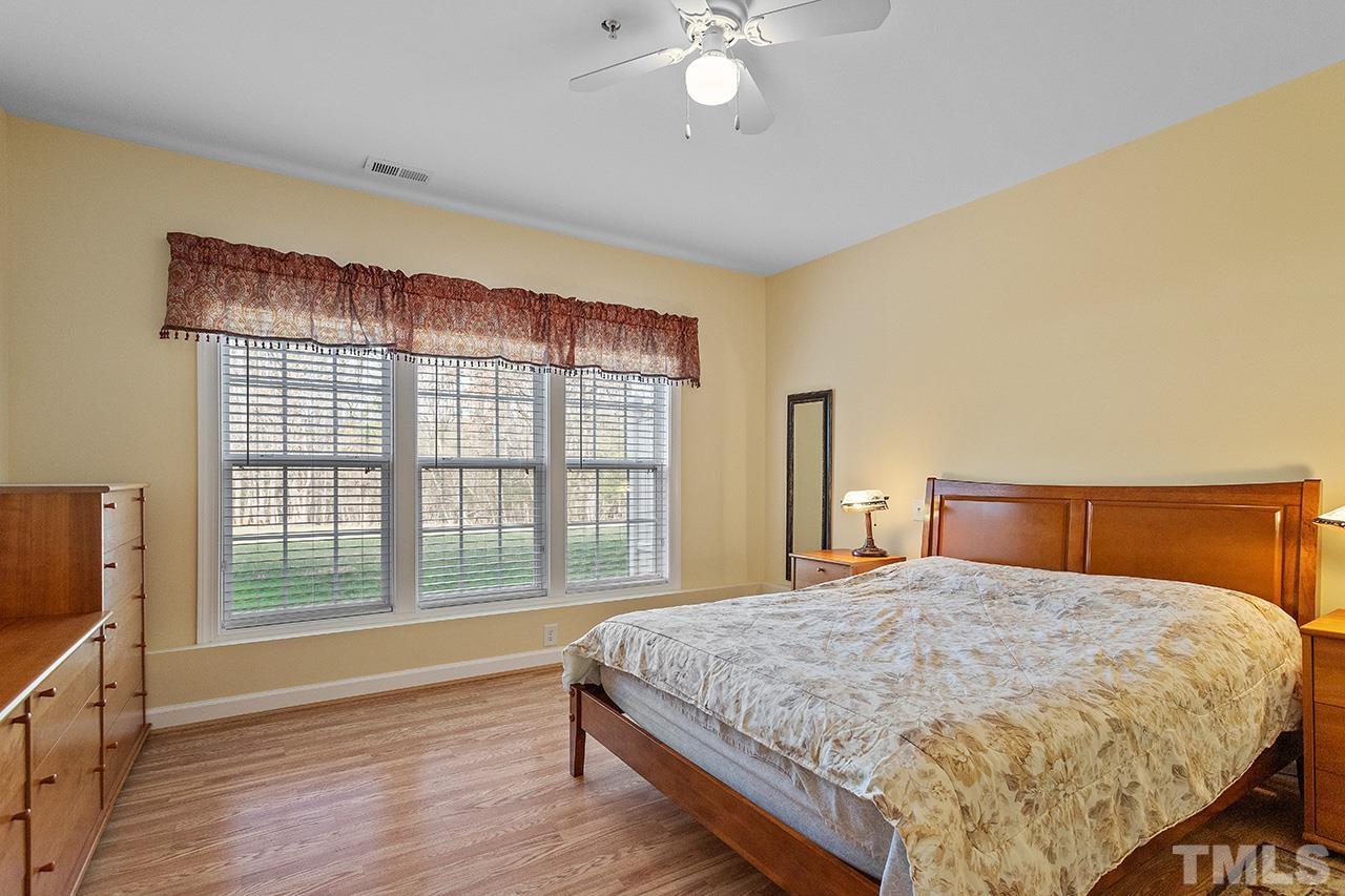 203 Towne Ridge Lane Chapel Hill, NC 27516 - Photo 36 of 38 a bedroom with a large bed and a large window