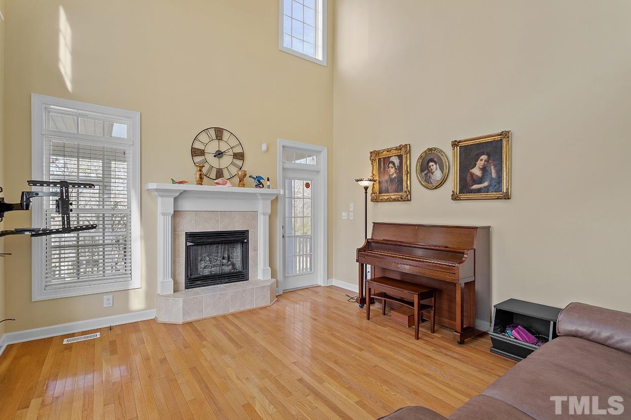 203 Towne Ridge Lane Chapel Hill, NC 27516 - Photo 5 of 38 a living room with furniture and a fireplace