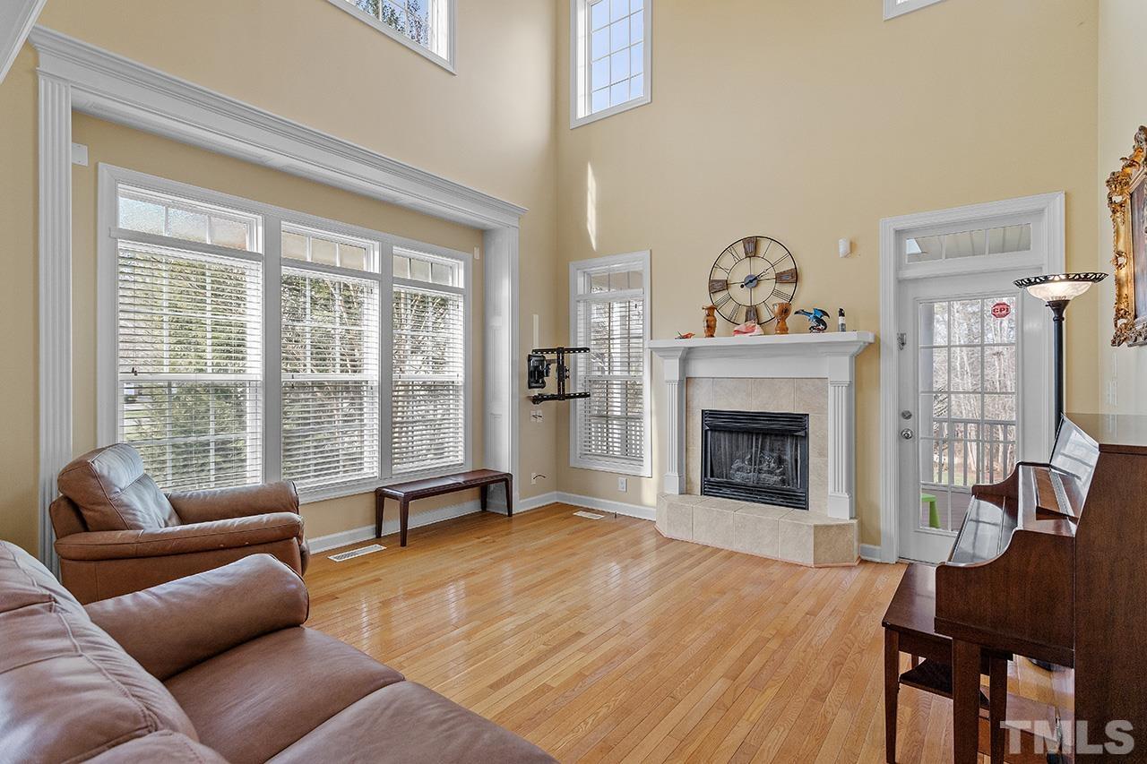 203 Towne Ridge Lane Chapel Hill, NC 27516 - Photo 6 of 38 a living room with furniture large window and a fireplace
