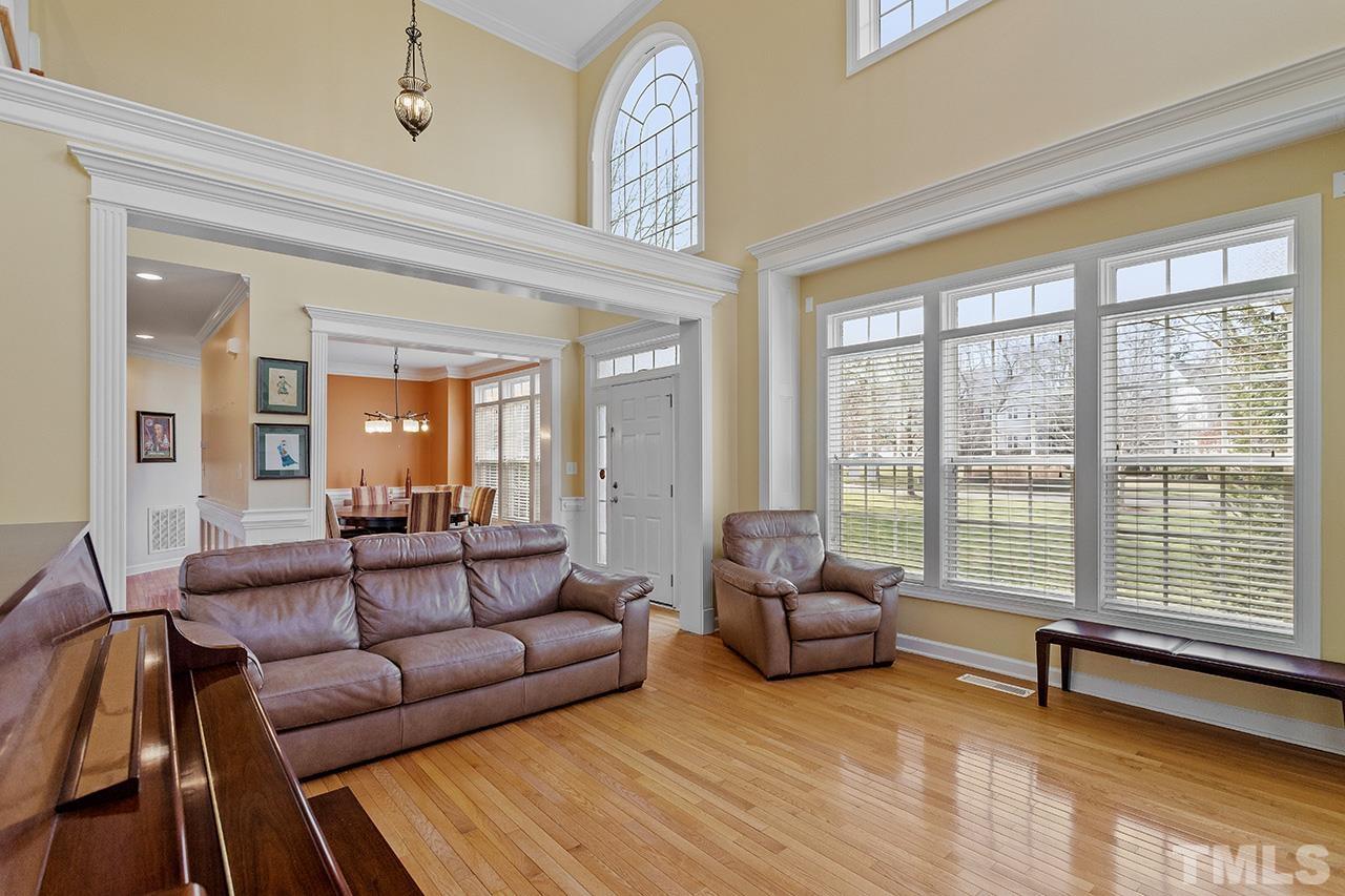 203 Towne Ridge Lane Chapel Hill, NC 27516 - Photo 7 of 38 a living room with furniture and a large window