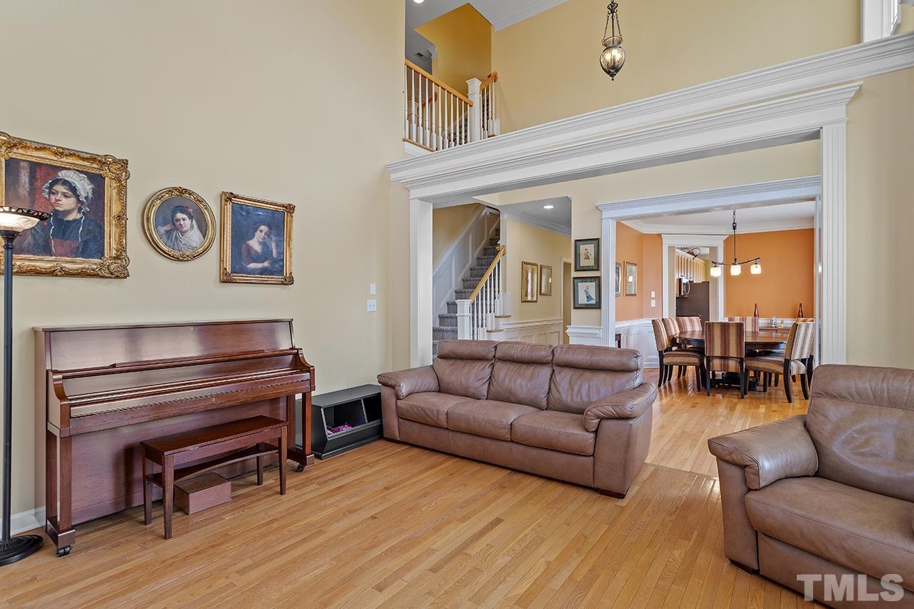 203 Towne Ridge Lane Chapel Hill, NC 27516 - Photo 8 of 38 a living room with furniture and a piano