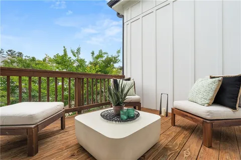 a view of a balcony with furniture