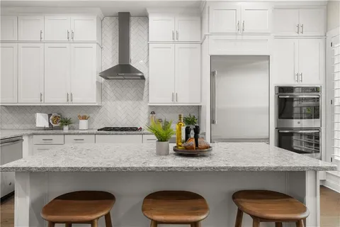a kitchen with appliances cabinets and a counter space