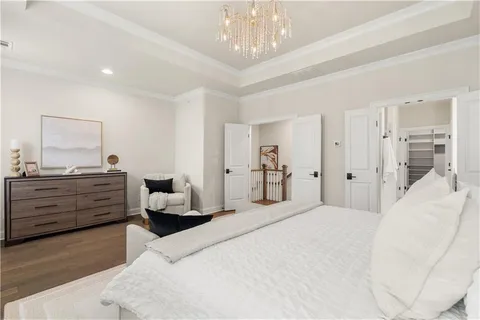 a bedroom with a bed and ceiling fan