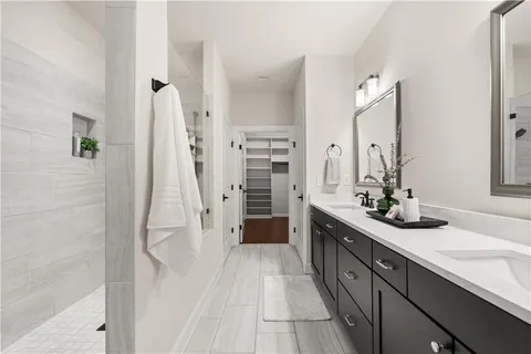 a bathroom with a double vanity sink and mirror