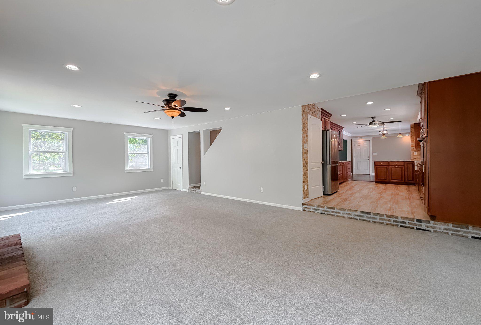 2420 Cecil Lane Huntingtown, MD 20639 - Photo 14 of 72 Spacious, light-filled living area.