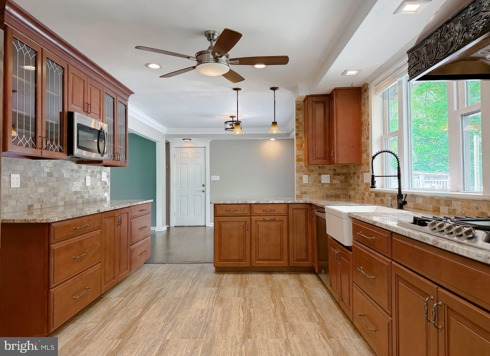 2420 Cecil Lane Huntingtown, MD 20639 - Photo 17 of 72 Modern kitchen with warm wood tones.