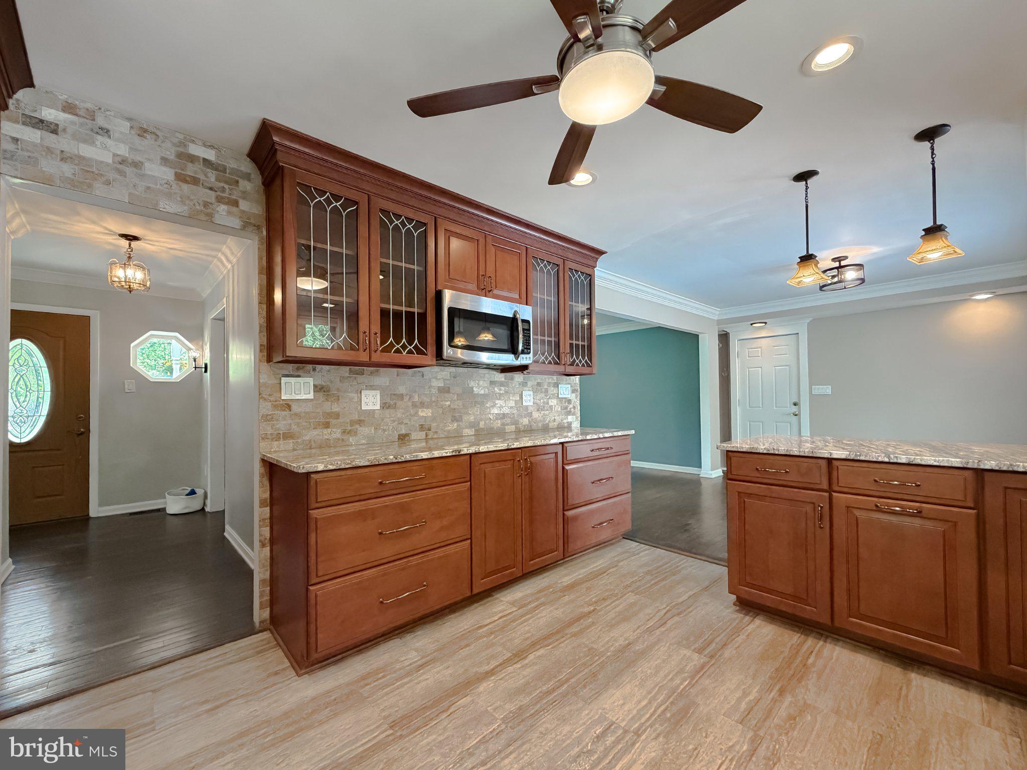 2420 Cecil Lane Huntingtown, MD 20639 - Photo 18 of 72 Charming kitchen with rich wood accents.