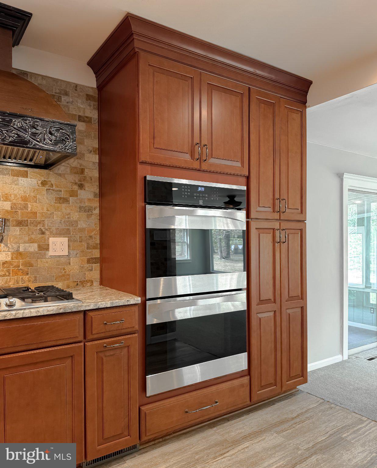 2420 Cecil Lane Huntingtown, MD 20639 - Photo 21 of 72 Sleek modern kitchen with rich cabinetry.