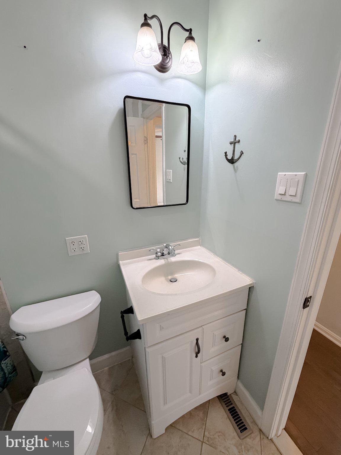 2420 Cecil Lane Huntingtown, MD 20639 - Photo 34 of 72 Coastal charm in a serene bathroom.