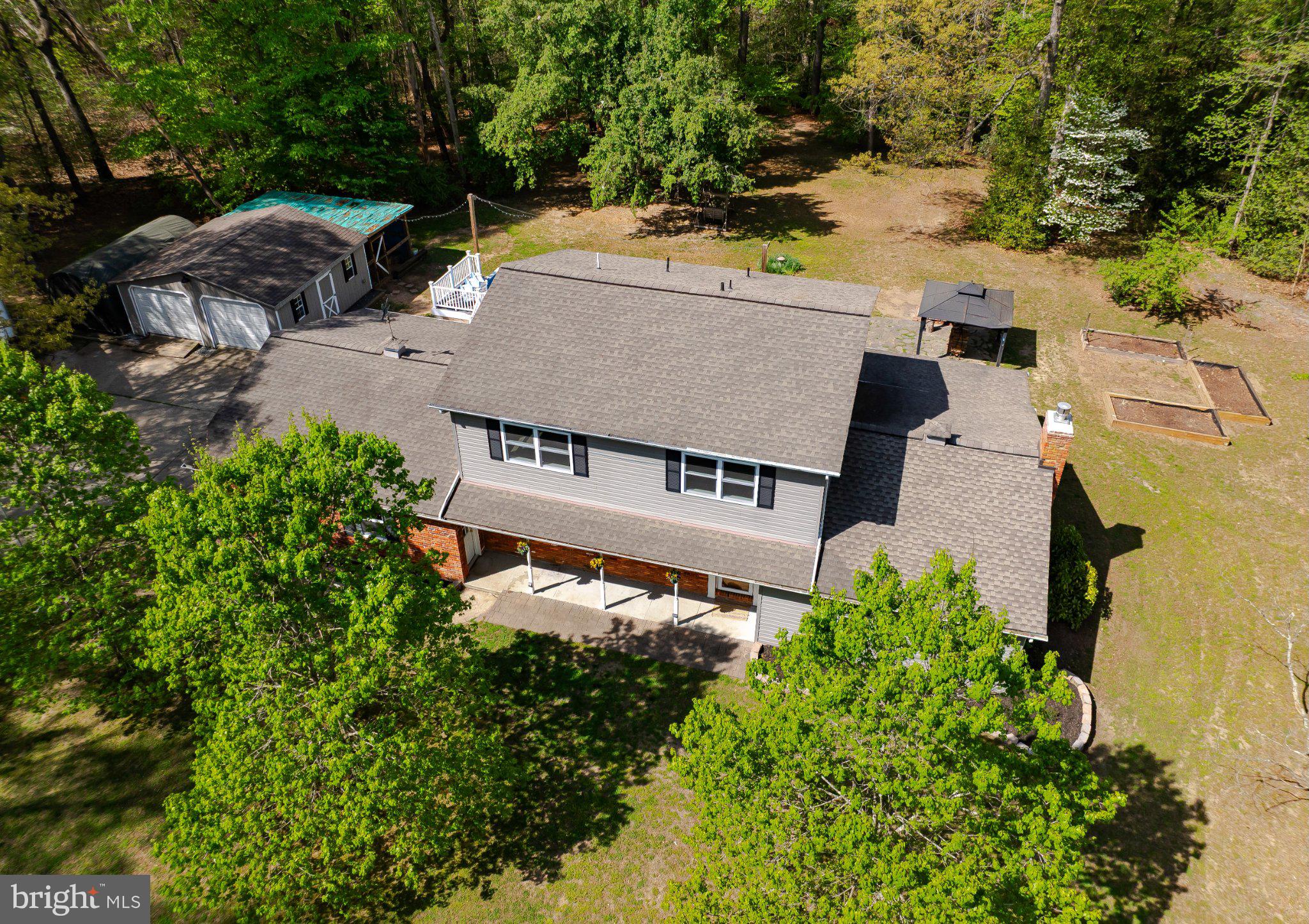 2420 Cecil Lane Huntingtown, MD 20639 - Photo 4 of 72 Spacious home nestled in lush greenery.