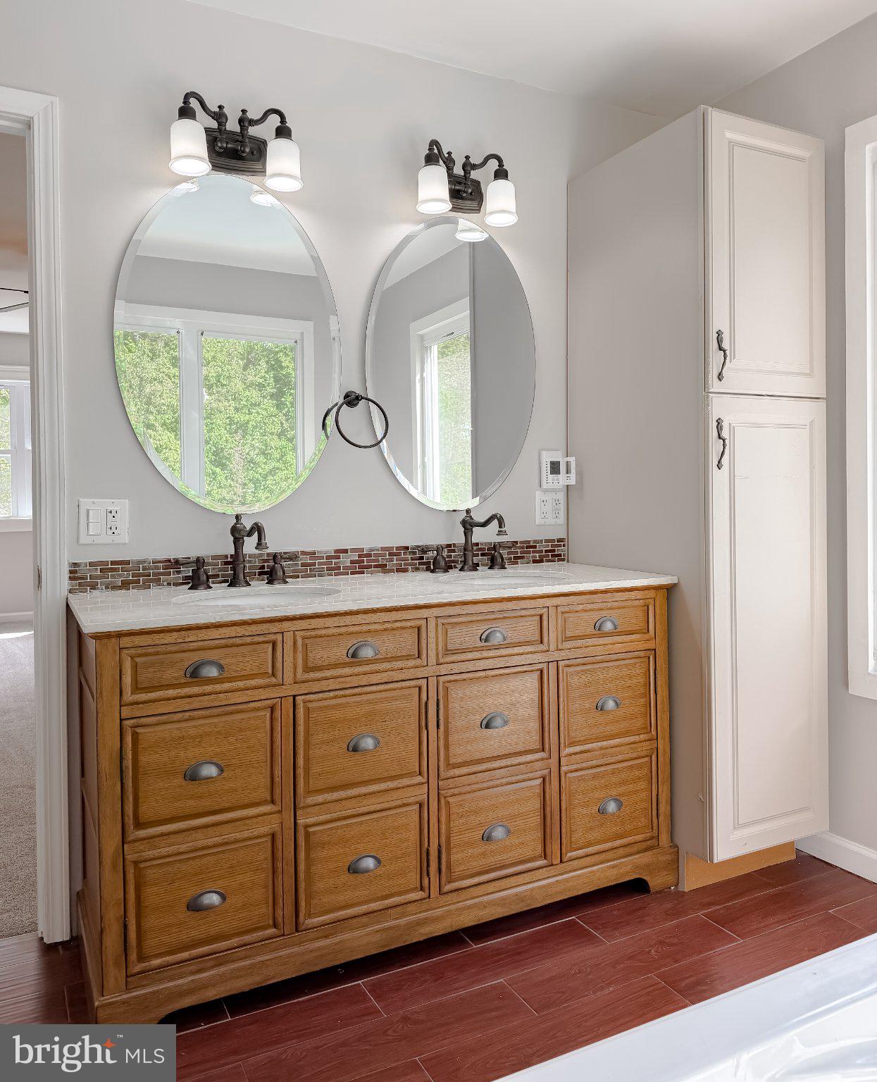 2420 Cecil Lane Huntingtown, MD 20639 - Photo 46 of 72 Elegant dual-sink bathroom retreat.