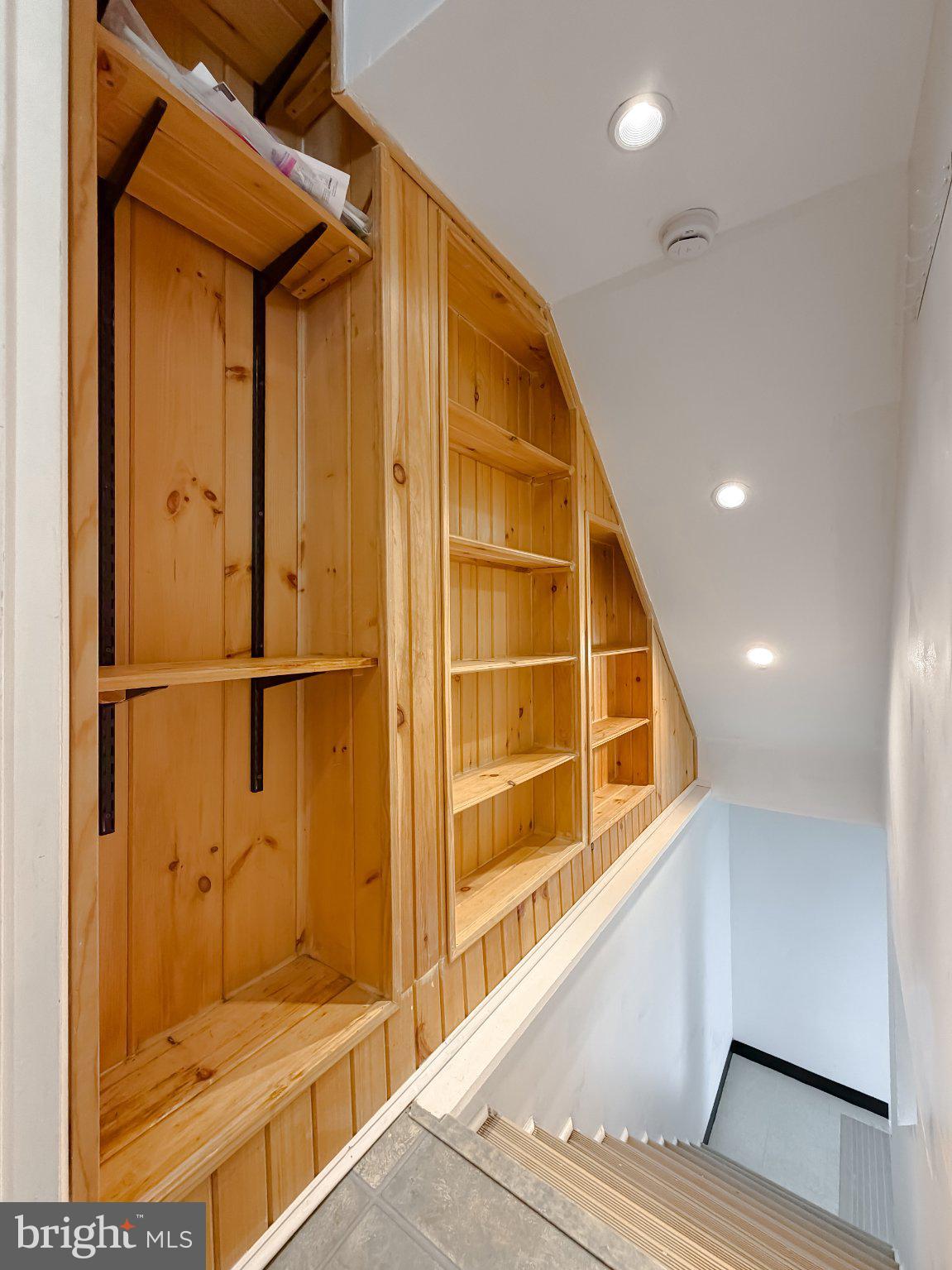 2420 Cecil Lane Huntingtown, MD 20639 - Photo 49 of 72 Stylish wooden shelving in a staircase.