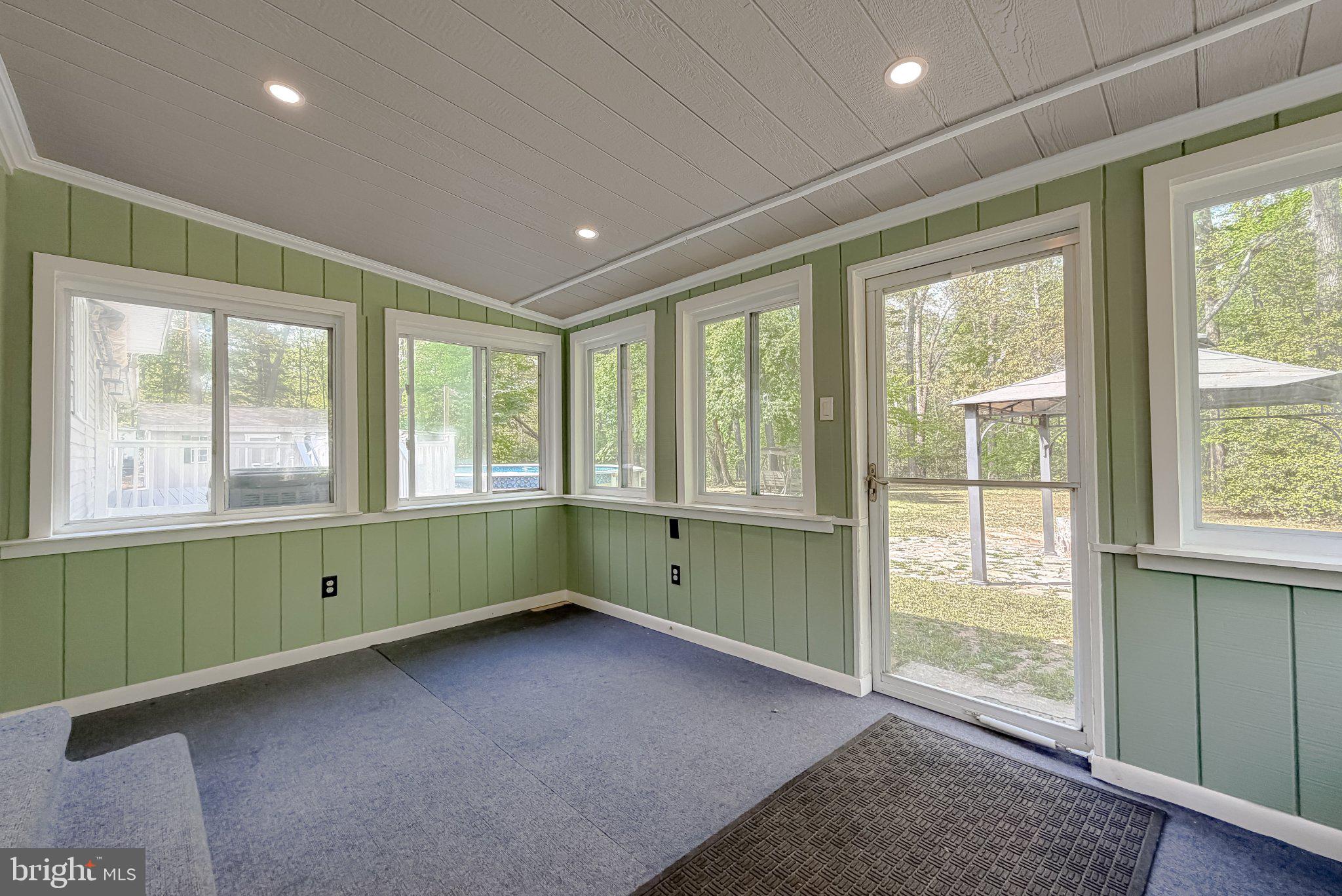 2420 Cecil Lane Huntingtown, MD 20639 - Photo 53 of 72 Bright sunroom with serene views.