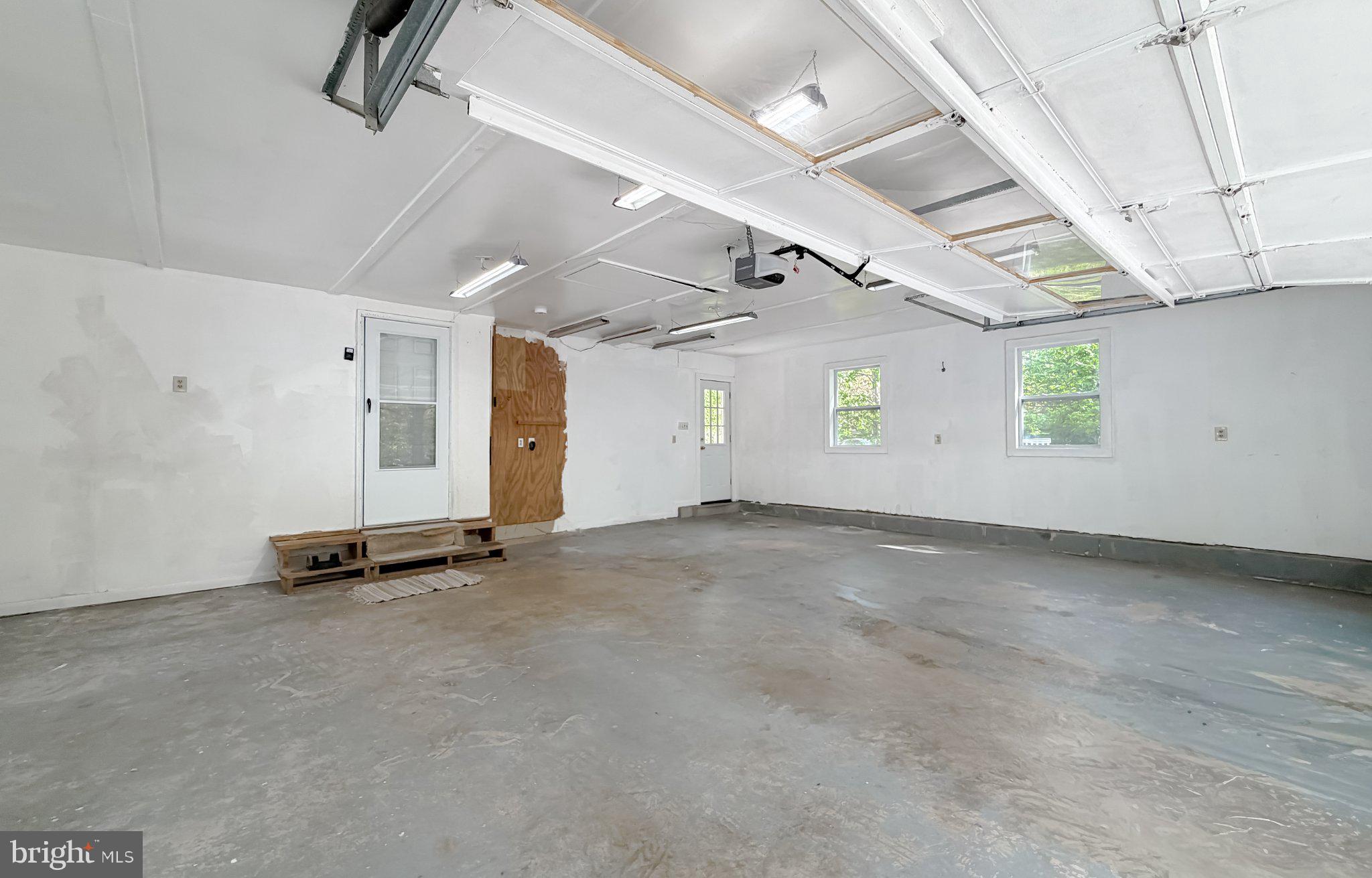 2420 Cecil Lane Huntingtown, MD 20639 - Photo 55 of 72 Spacious garage with natural light.