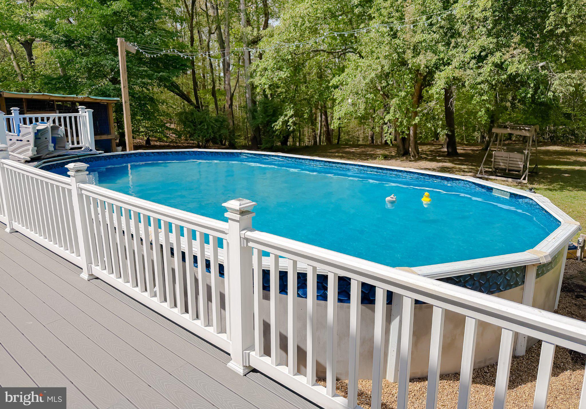 2420 Cecil Lane Huntingtown, MD 20639 - Photo 59 of 72 Tranquil backyard oasis with pool.