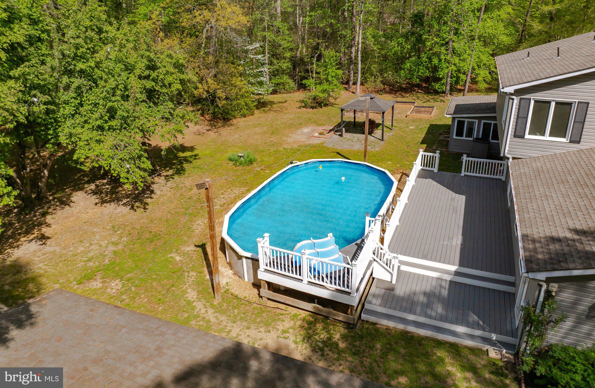 2420 Cecil Lane Huntingtown, MD 20639 - Photo 6 of 72 Serene backyard oasis with pool.