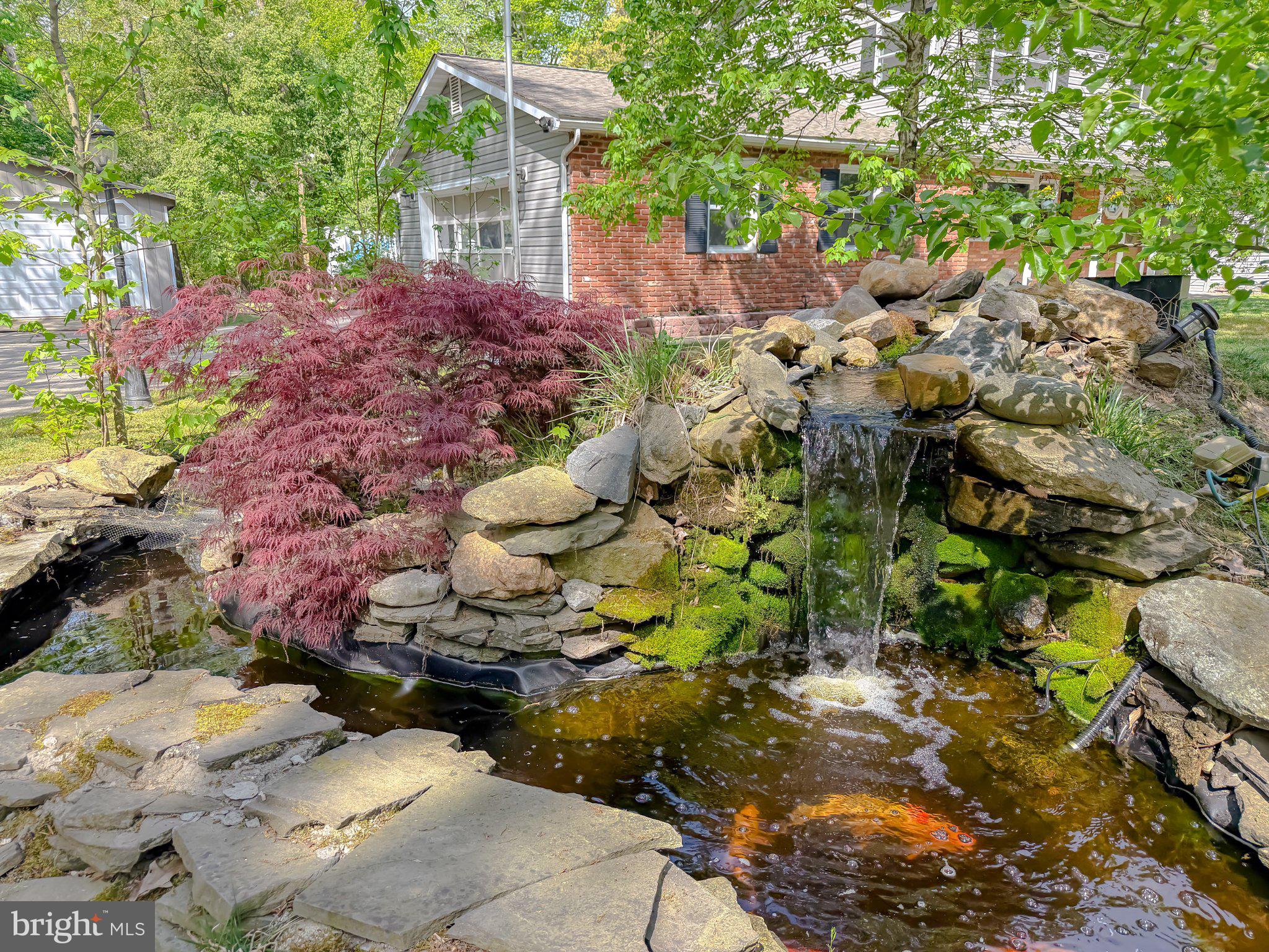 2420 Cecil Lane Huntingtown, MD 20639 - Photo 68 of 72 Tranquil garden pond with waterfall.