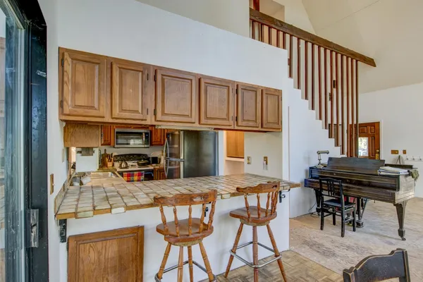 a kitchen with a stove a sink and a microwave