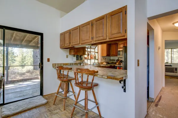 a kitchen with a sink and a stove top oven