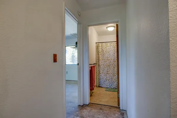 a view of an empty room with a window