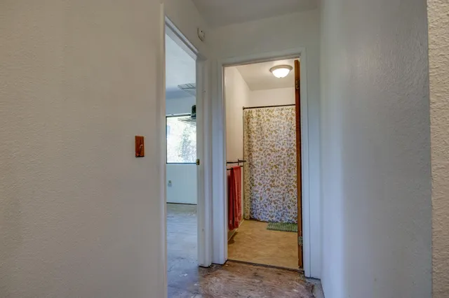 a view of an empty room with a window