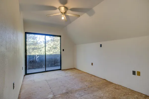 a backyard of a house with yard and outdoor seating