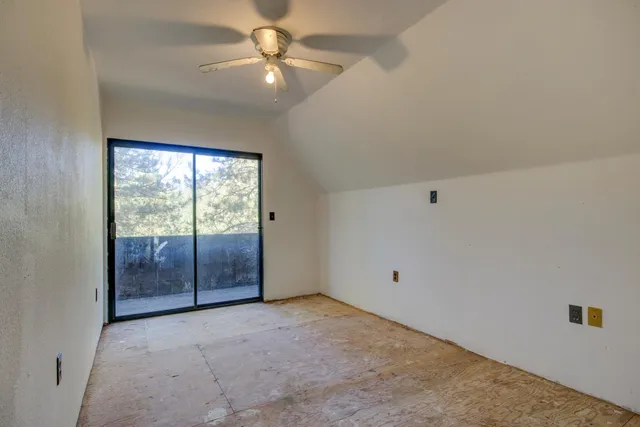 a backyard of a house with yard and outdoor seating
