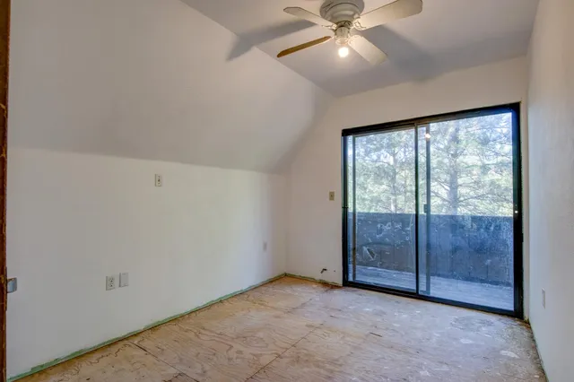 a view of a tree in the middle of a yard