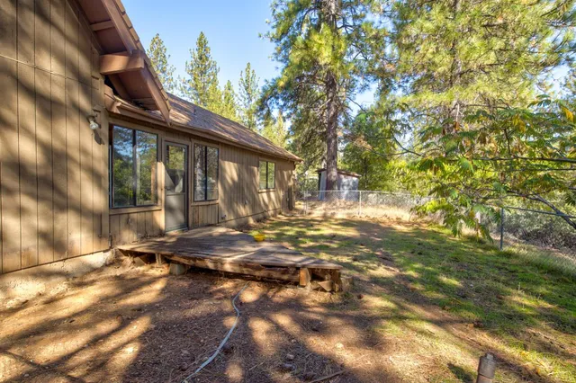 a view of a lush green hillside and a mountain