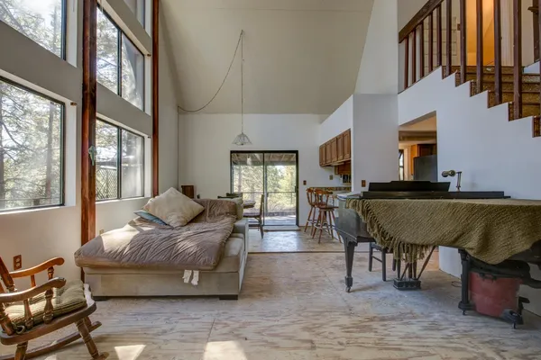 a bedroom with furniture and a wooden floor