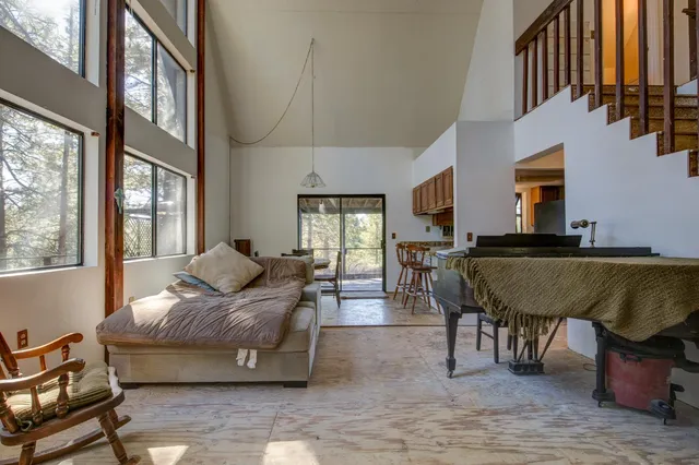 a bedroom with furniture and a wooden floor