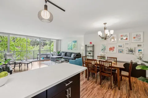 a kitchen with sink cabinets and wooden floor