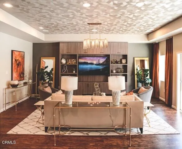 a living room with fireplace furniture and a table