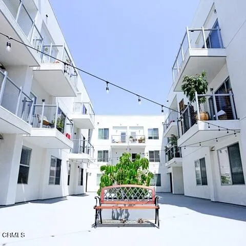a living room with furniture and a clock