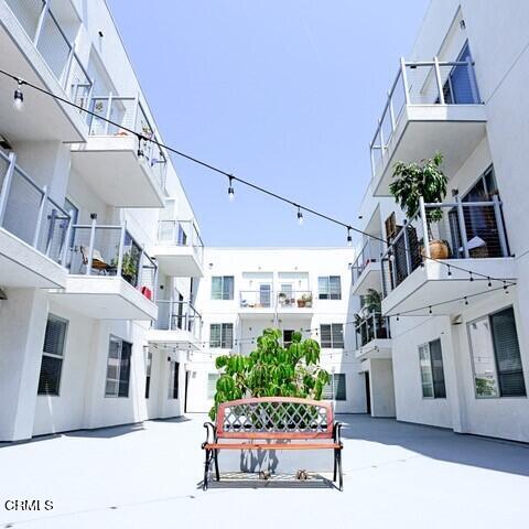 300 West 9th Street Oxnard, CA 93030 - Photo 5 of 12 a living room with furniture and a clock