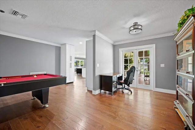 a living room with furniture window and wooden floor
