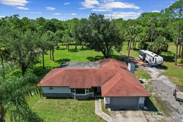 a view of a garden with an outdoor space