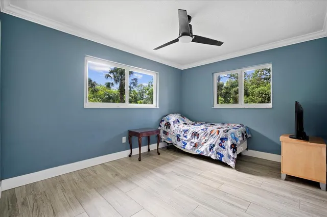 a bedroom with bed and a window