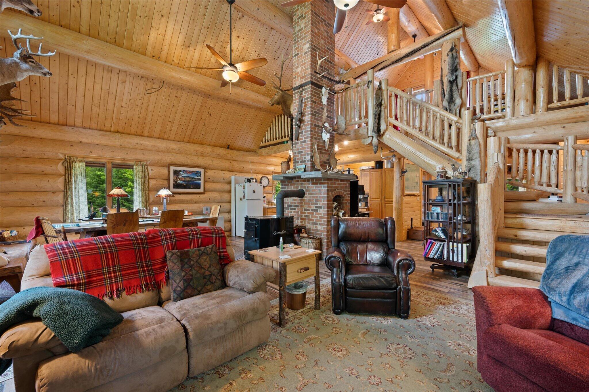 314 Atwood Pond Road Patten, ME 04765 - Photo 25 of 76 Living Room-beamed cathedral ceilings...