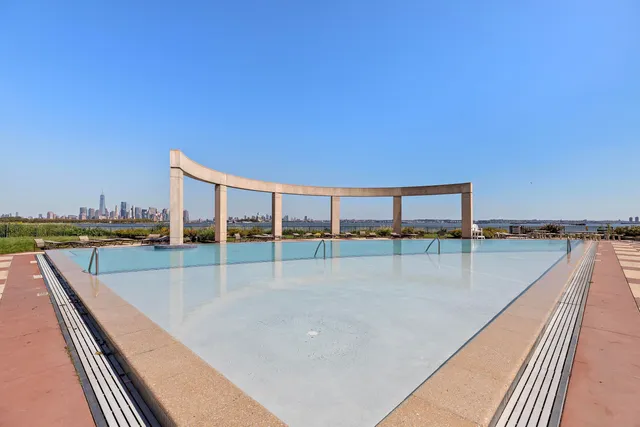 a view of a swimming pool with a balcony