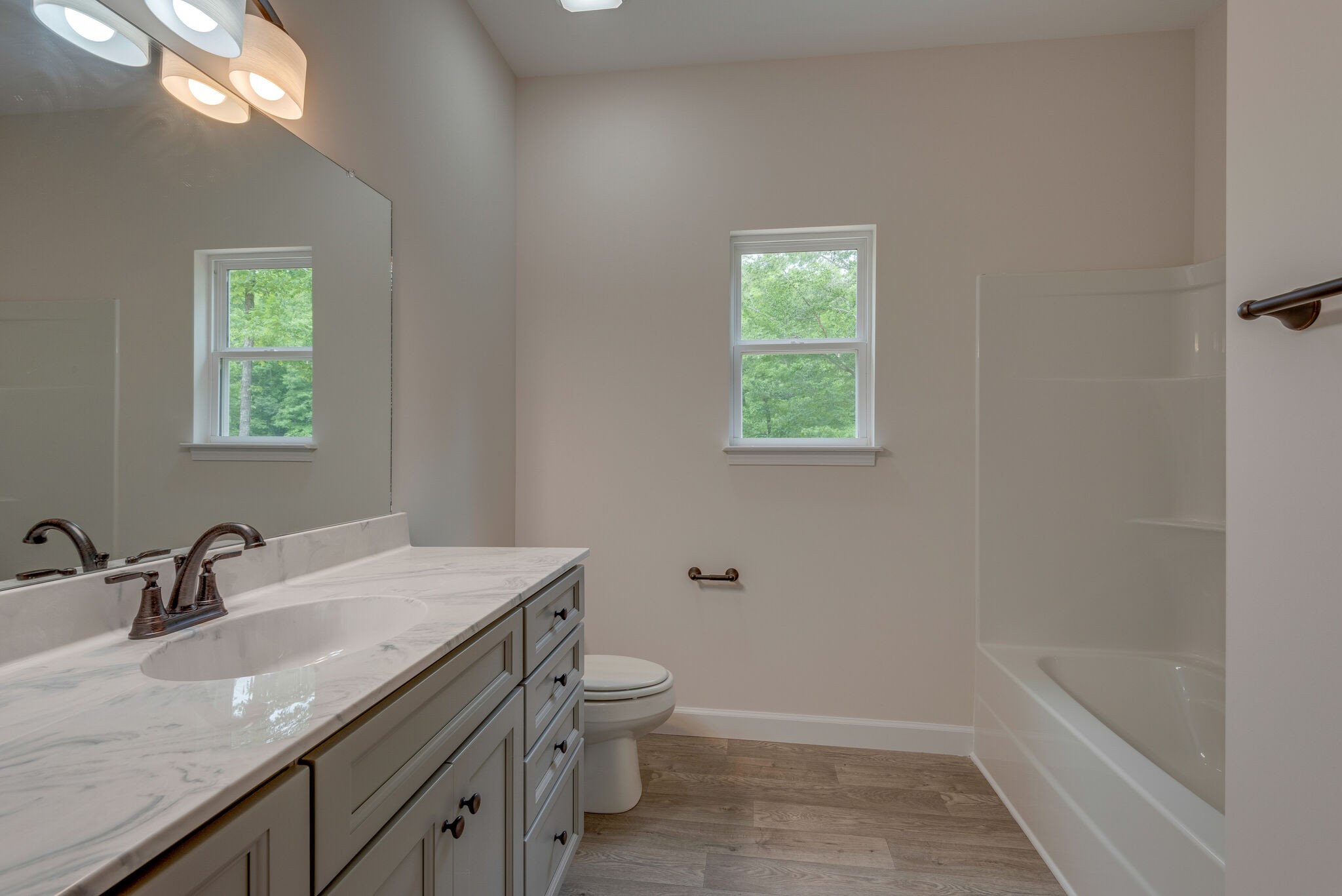 1170 Cowan Road Dickson, TN 37055 - Photo 16 of 30 a bathroom with a granite countertop sink a toilet and shower